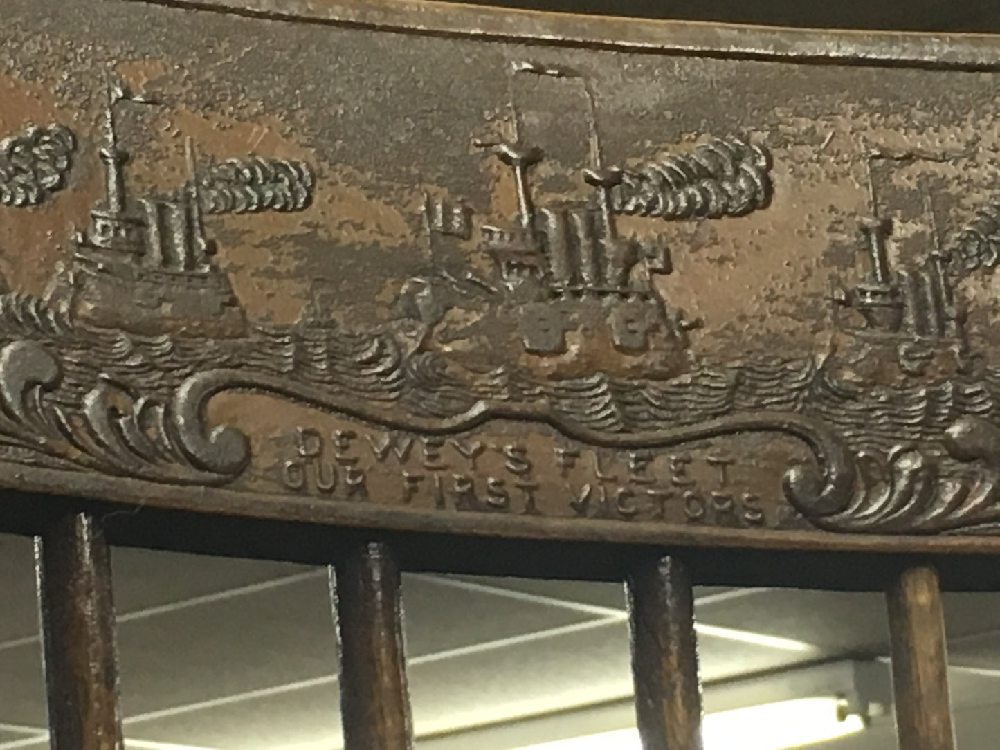 SPANISH AMERICAN WAR COMMEMORATIVE ROCKING CHAIR WITH SCENE OF DEWEY'S FLEET