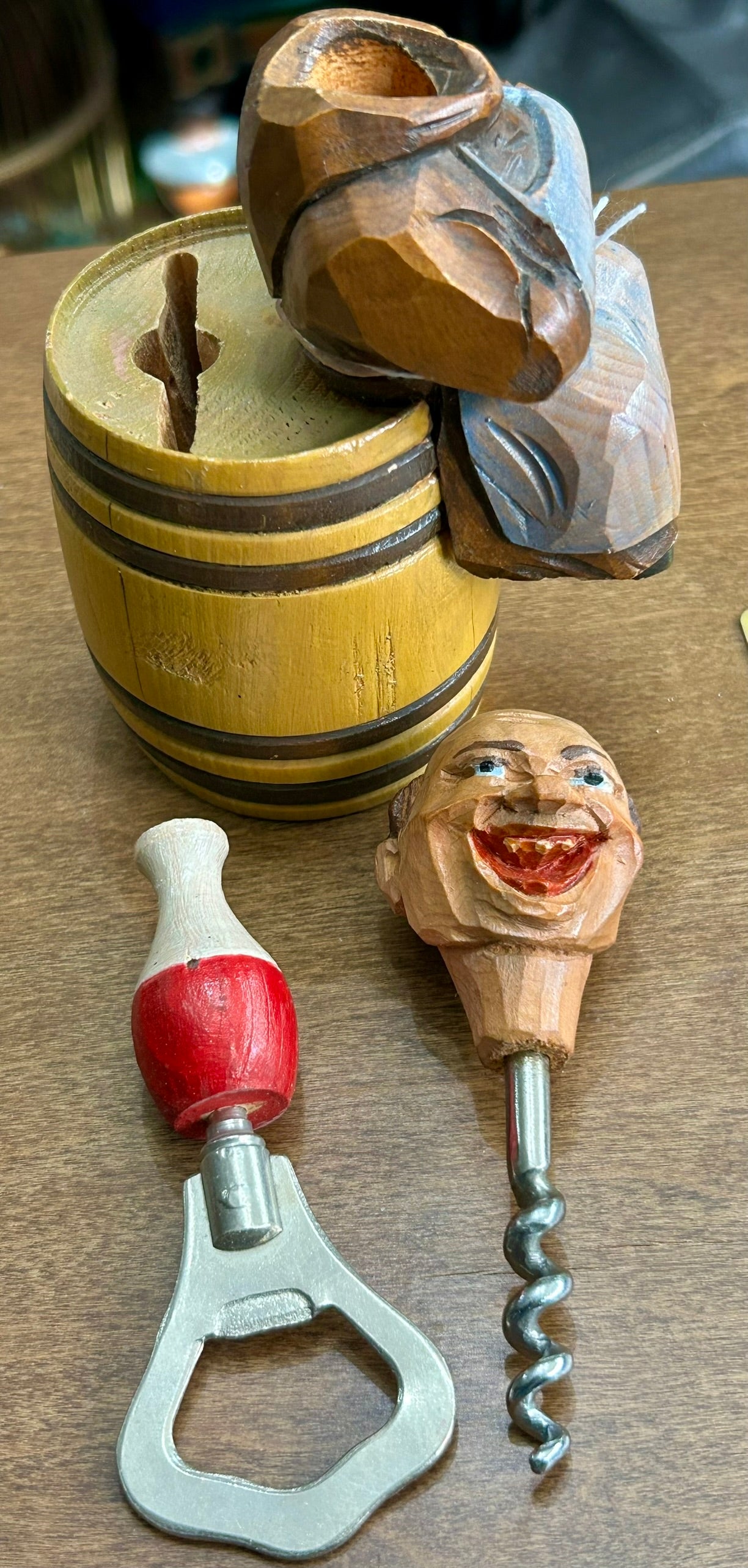 CARVED WOODEN FIGURAL CORKSCREW OF MONK SITTING ON BARREL WITH BOTTLE OPENER