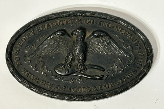 FIGURAL IRON ADVERTISING PAPERWEIGHT OF EAGLE HOLDING WRENCH FOR KRAEUTER & CO.
