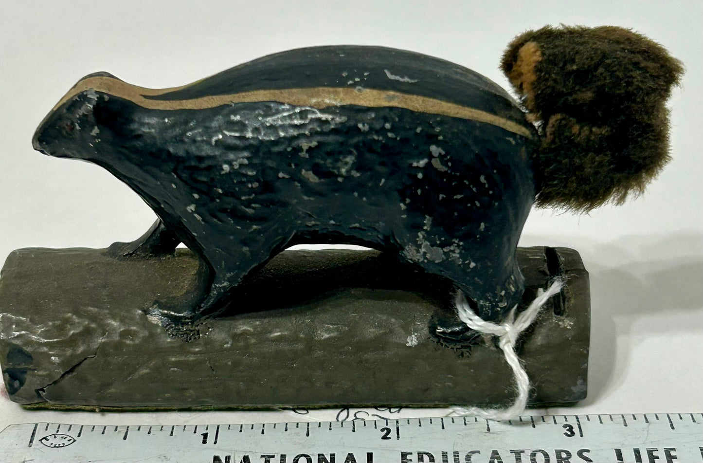 SKUNK METAL PAPERWEIGHT WITH SLOT FOR PENNEY