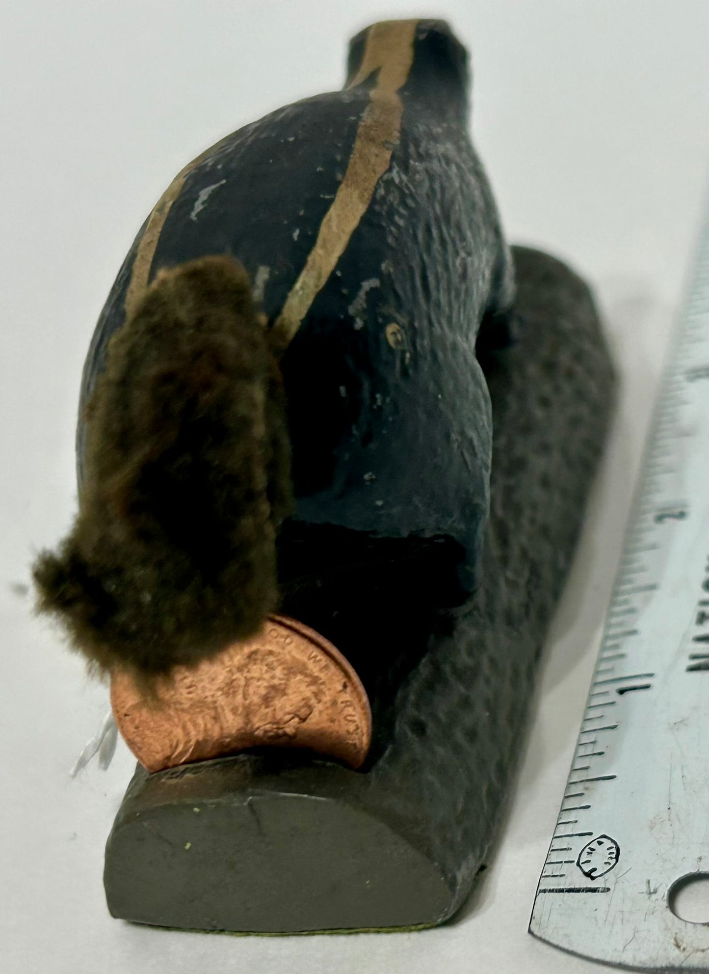 SKUNK METAL PAPERWEIGHT WITH SLOT FOR PENNEY