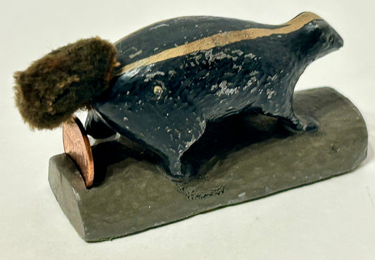 SKUNK METAL PAPERWEIGHT WITH SLOT FOR PENNEY