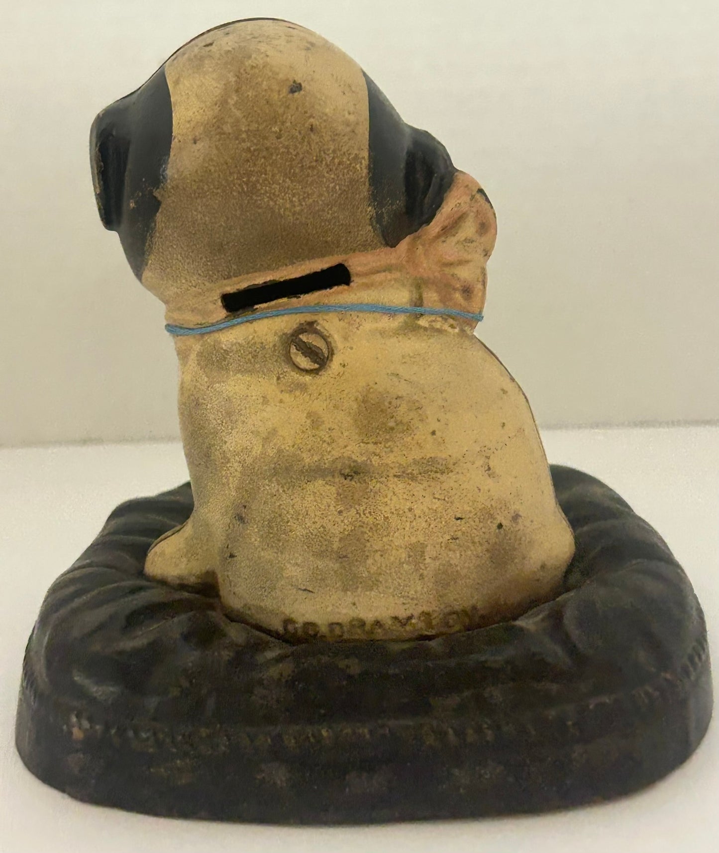 ANTIQUE CAST IRON BANK FIDO ON A PILLOW