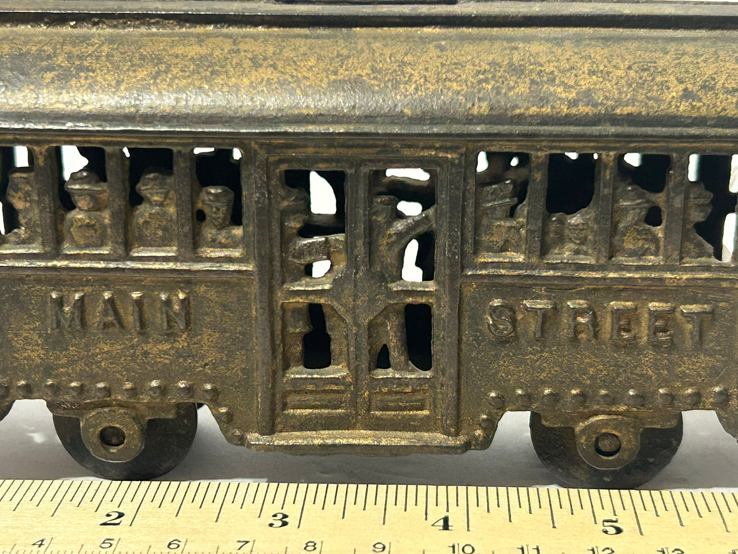 ANTIQUE CAST IRON TROLLY STILL BANK WITH PEOPLE