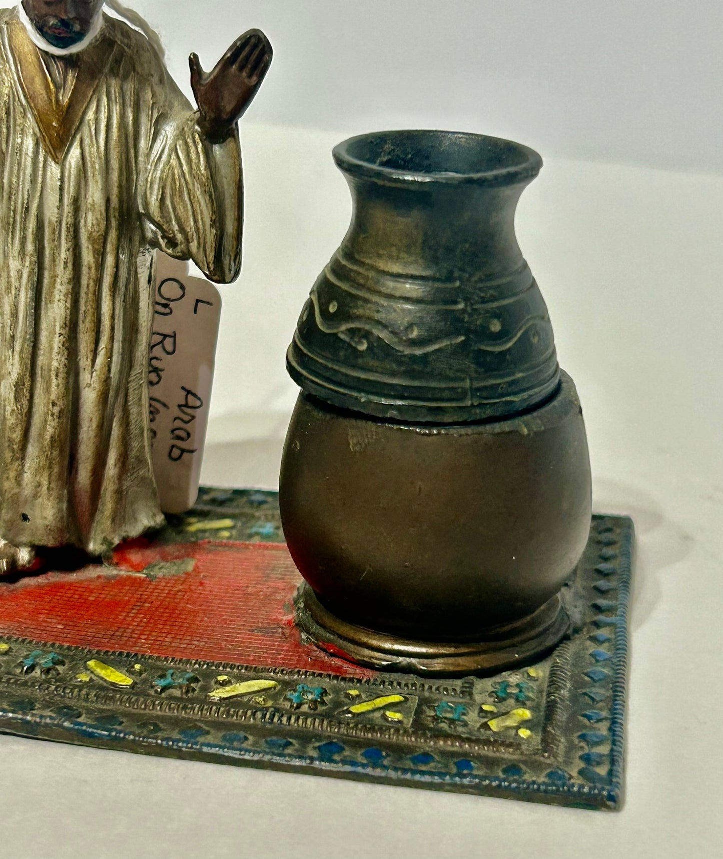 FIGURAL METAL INCENSE BURNER OF ARAB ON RUG
