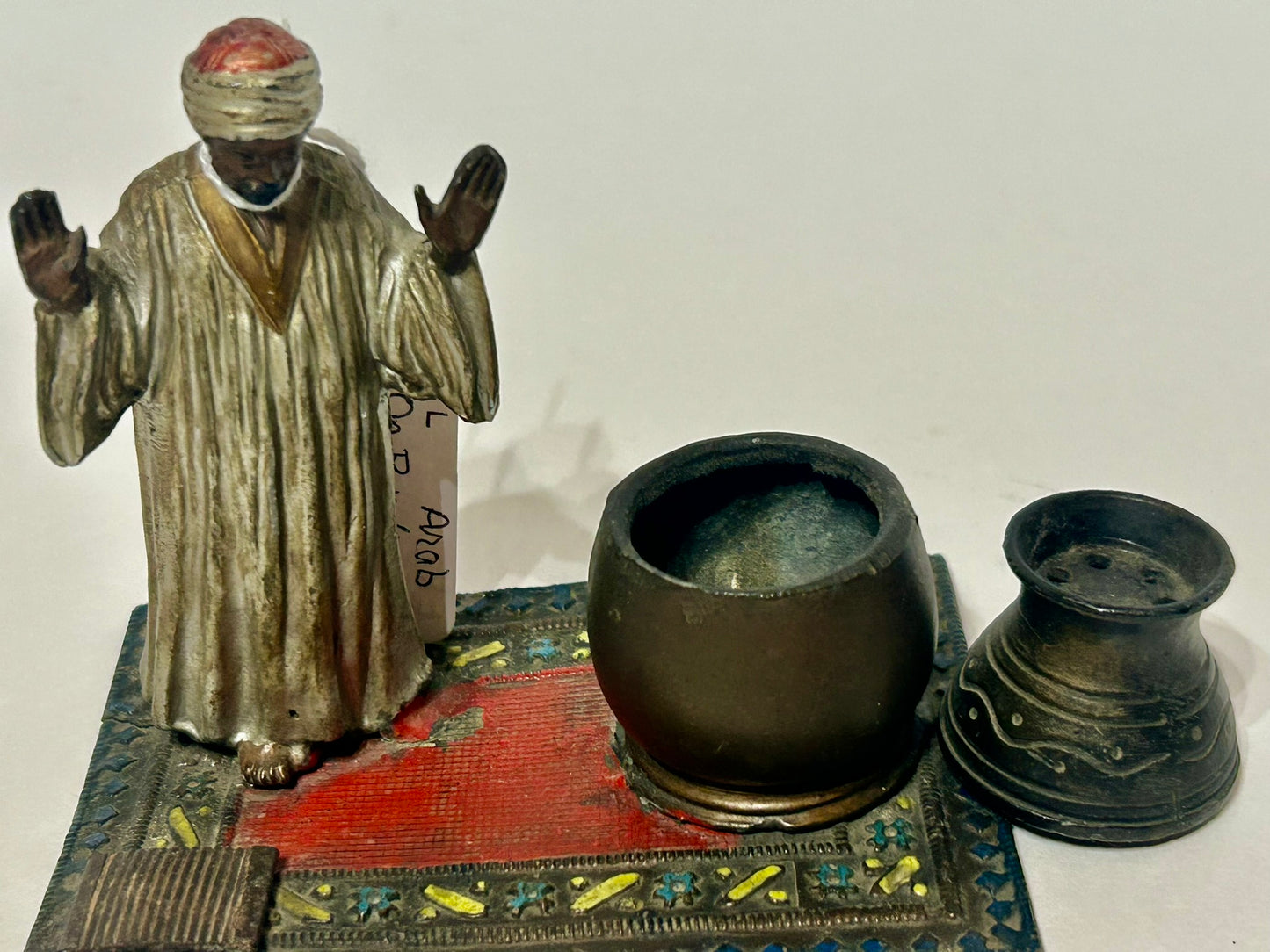 FIGURAL METAL INCENSE BURNER OF ARAB ON RUG