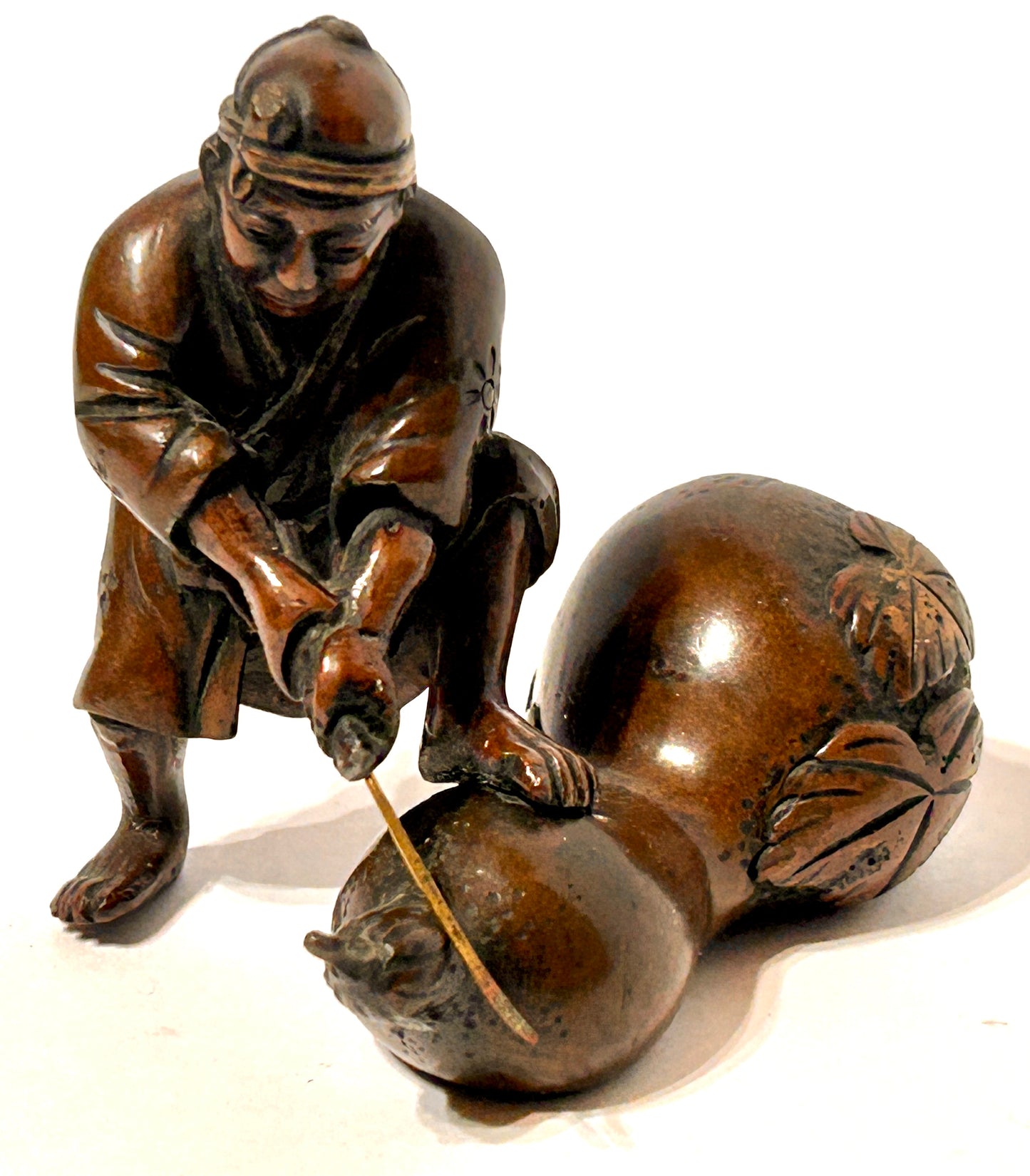 ANTIQUE ASIAN BRONZE OF MAN CUTTING GOURD