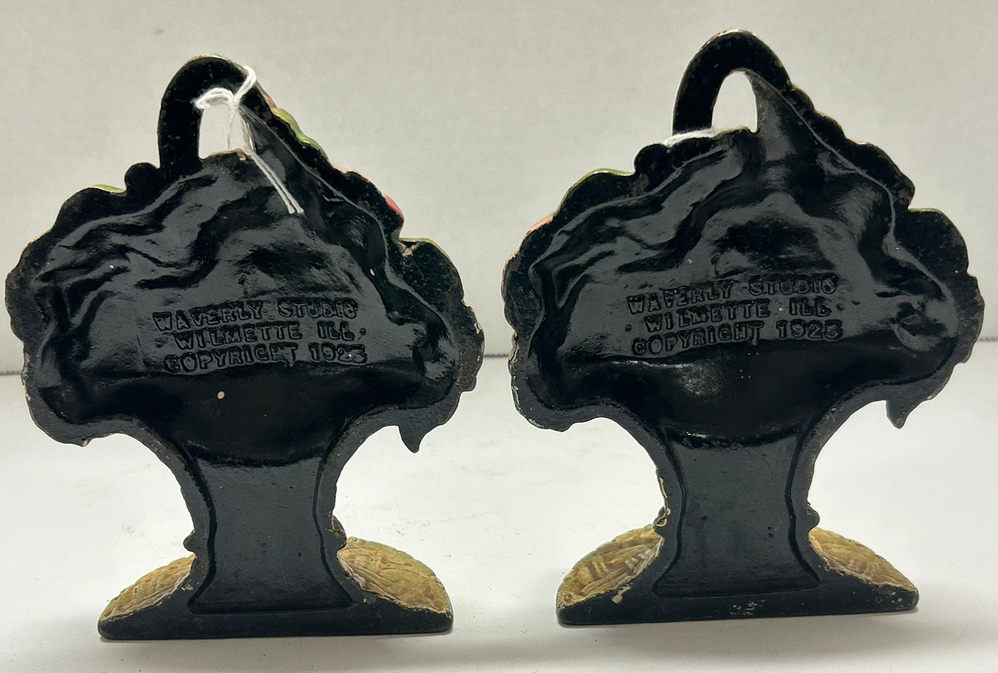 CAST IRON BOOKENDS OF FLOWERS IN BASKET