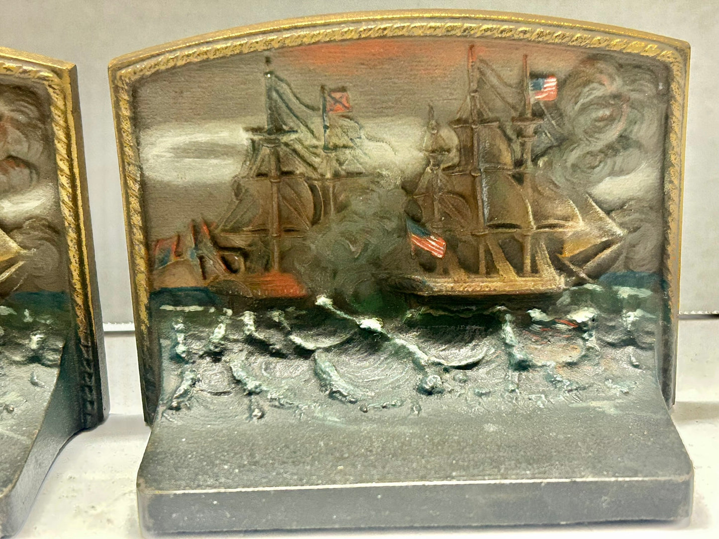 CAST IRON BOOKENDS OF CONSTITUTION SHIP IN BATTLE BY BRADLEY AND HUBBARD