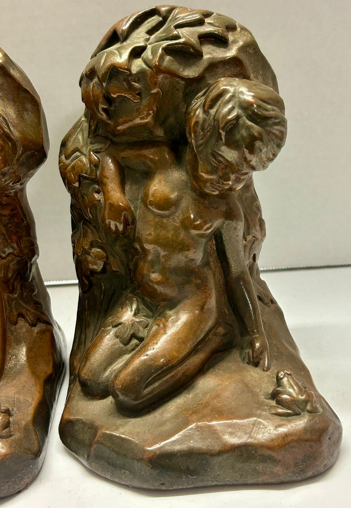 BRONZE CLAD BOOKENDS FIGURAL BOY WITH FROG SIGNED