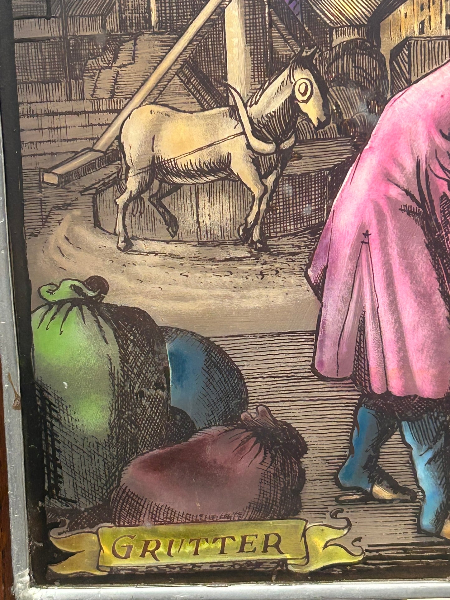 HAND DECORATED HANGING GLASS PANEL OF "GRUTTER" OR MILLER OCCUPATION