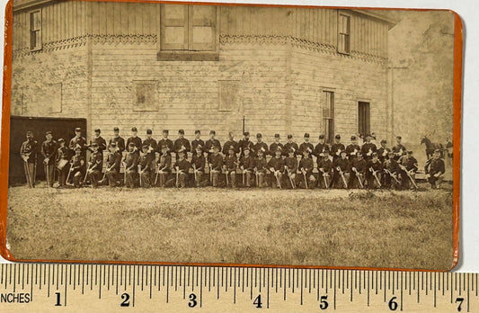 ON HOLD AND NOT SOLD YET.  LARGE GROUP OF SOLDIERS IN FRONT OF FORT BUILDING BY FREMONT NEBR. PHOTOGRAPHER A. C. HULL