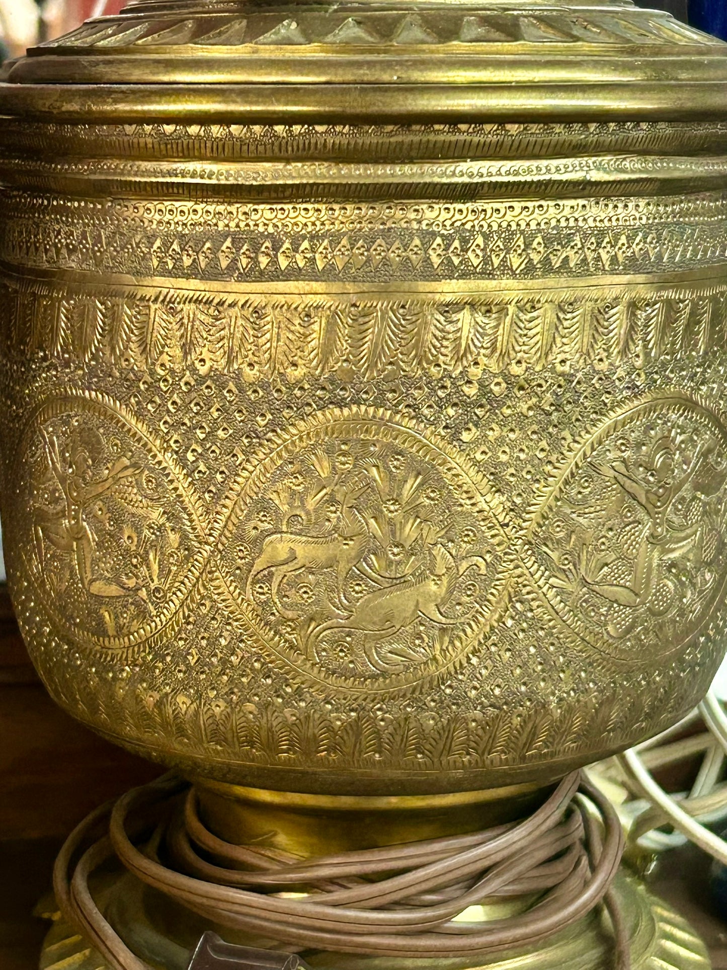 PERSIAN STYLE DECORATED BRASS LAMP BASE WITH RED GLOBE SHADE