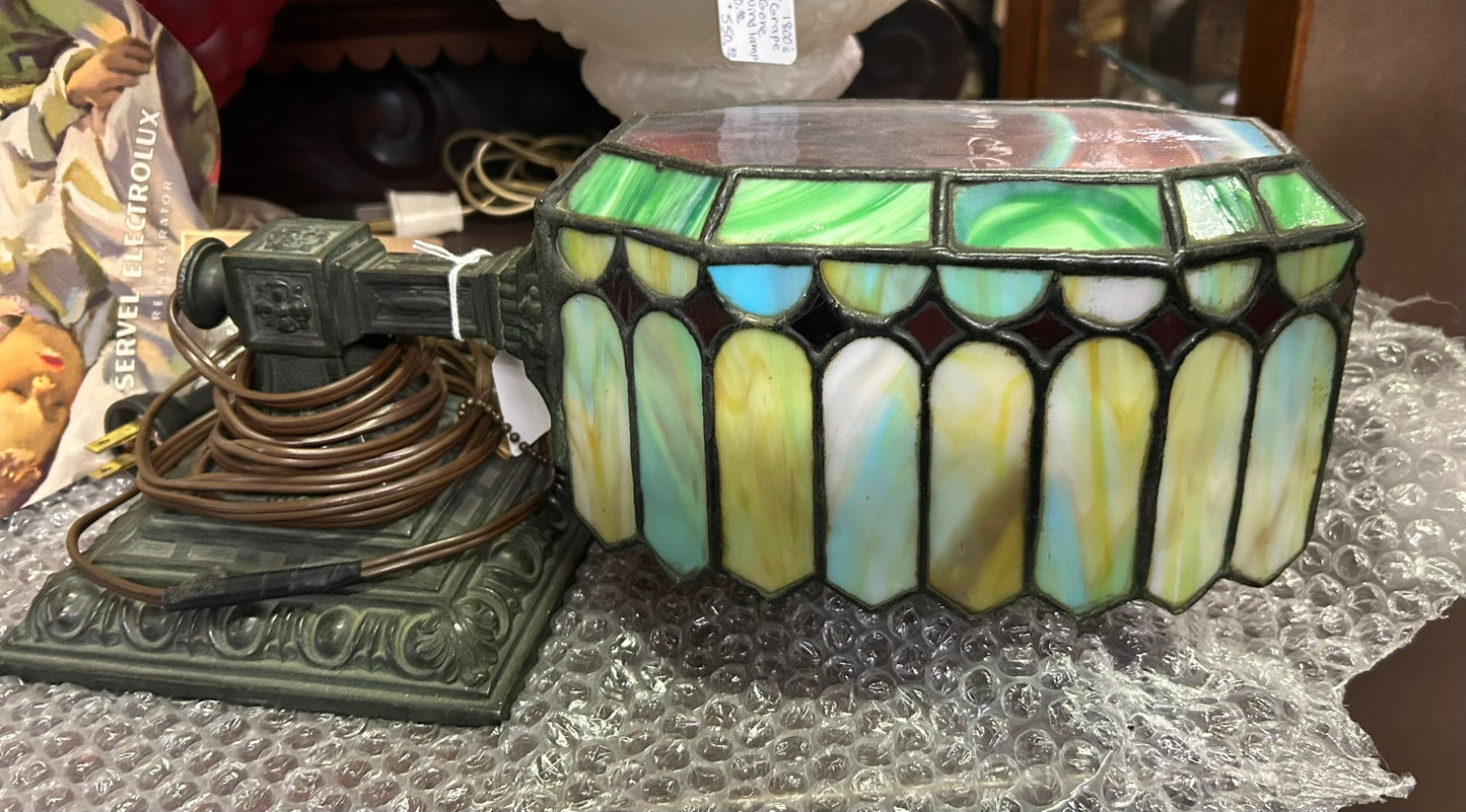 ANTIQUE DESK LAMP WITH ORNATE BASE AND LEADED SHADE