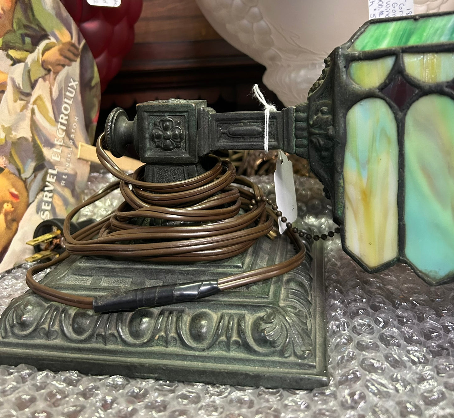 ANTIQUE DESK LAMP WITH ORNATE BASE AND LEADED SHADE