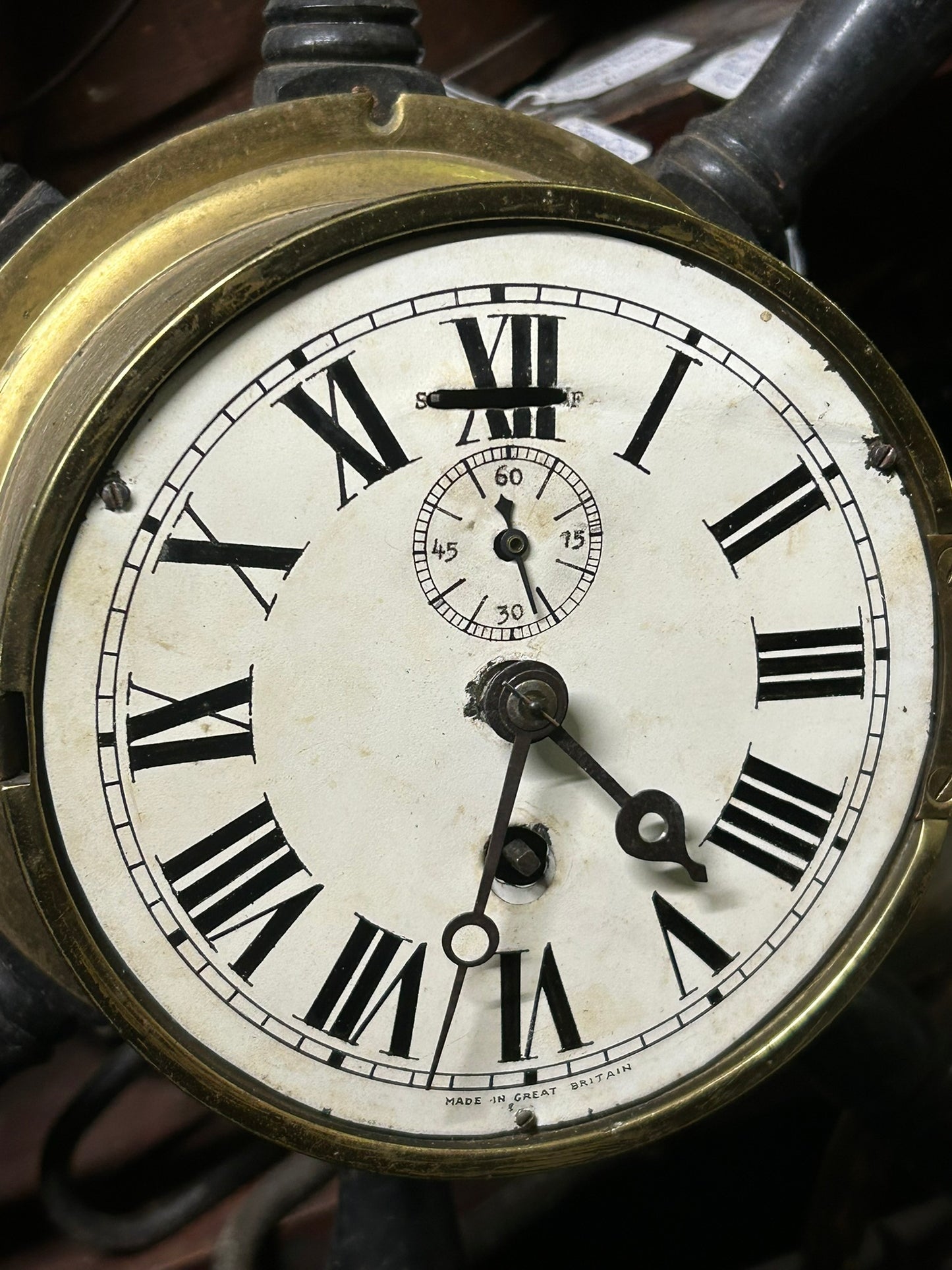 ANTIQUE WOOD SHIP'S WHEEL WITH ANTIQUE BRASS CLOCK IN CENTER
