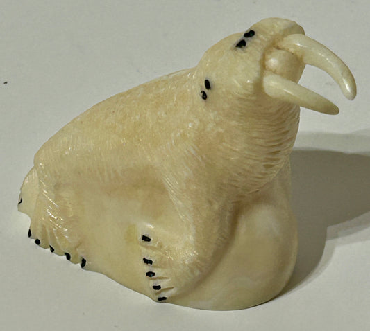 WALRUS IVORY CARVING OF ARTIST SIGNED WALRUS