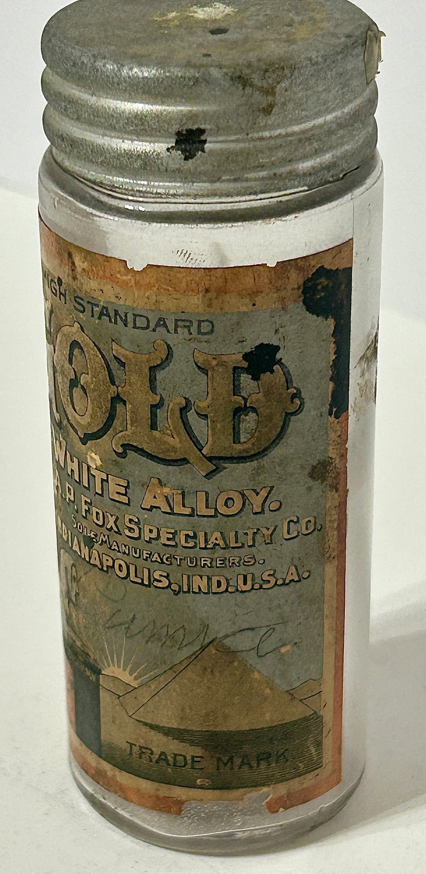 ANTIQUE BOTTLE LABELED GOLD ALLOY
