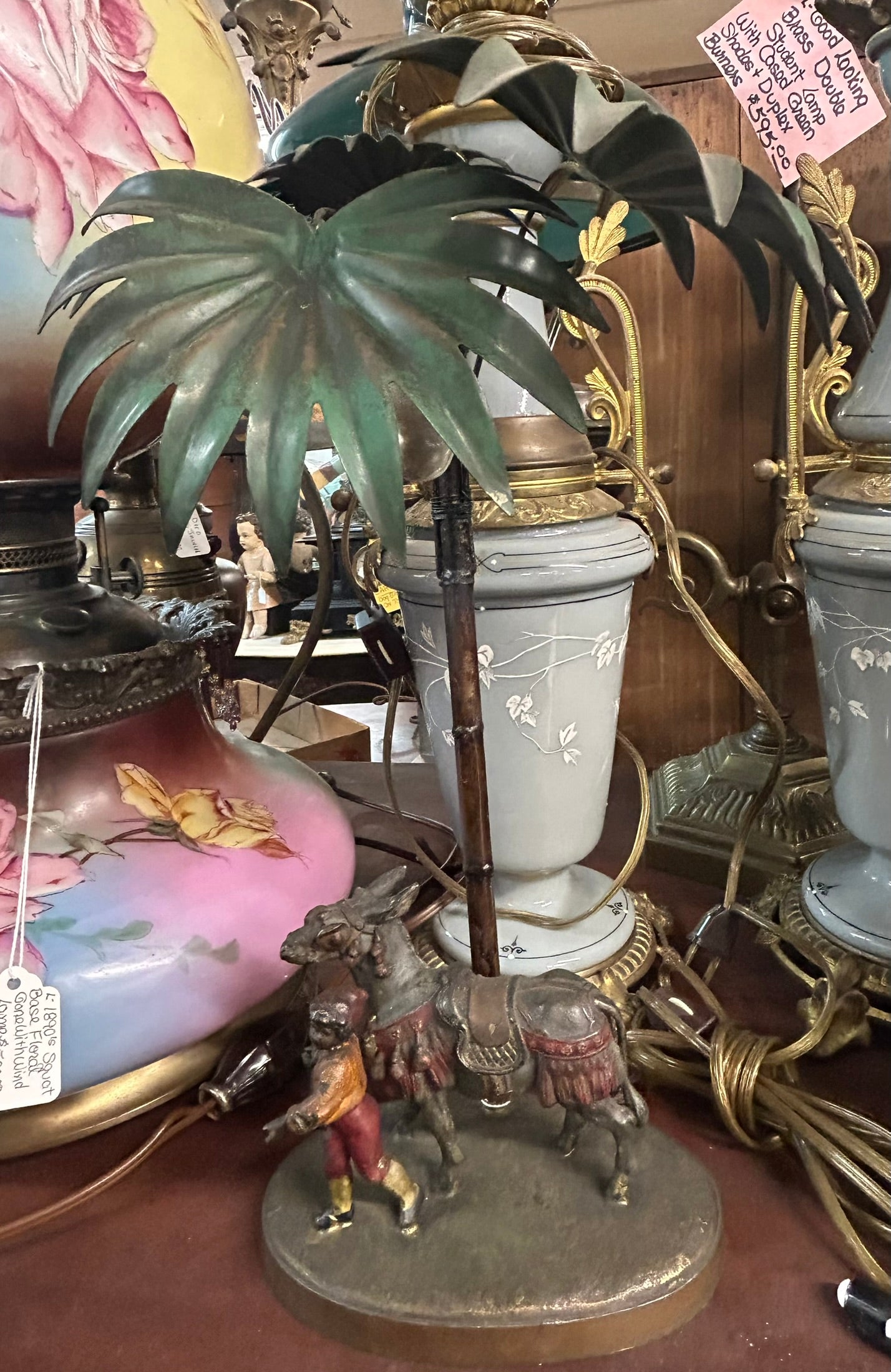 BERGMAN STYLE FIGURAL ANTIQUE LAMP WITH BOY AND DONKEY BY PALM TREE