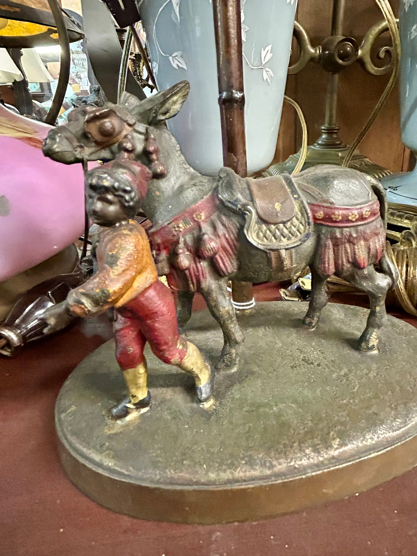 BERGMAN STYLE FIGURAL ANTIQUE LAMP WITH BOY AND DONKEY BY PALM TREE