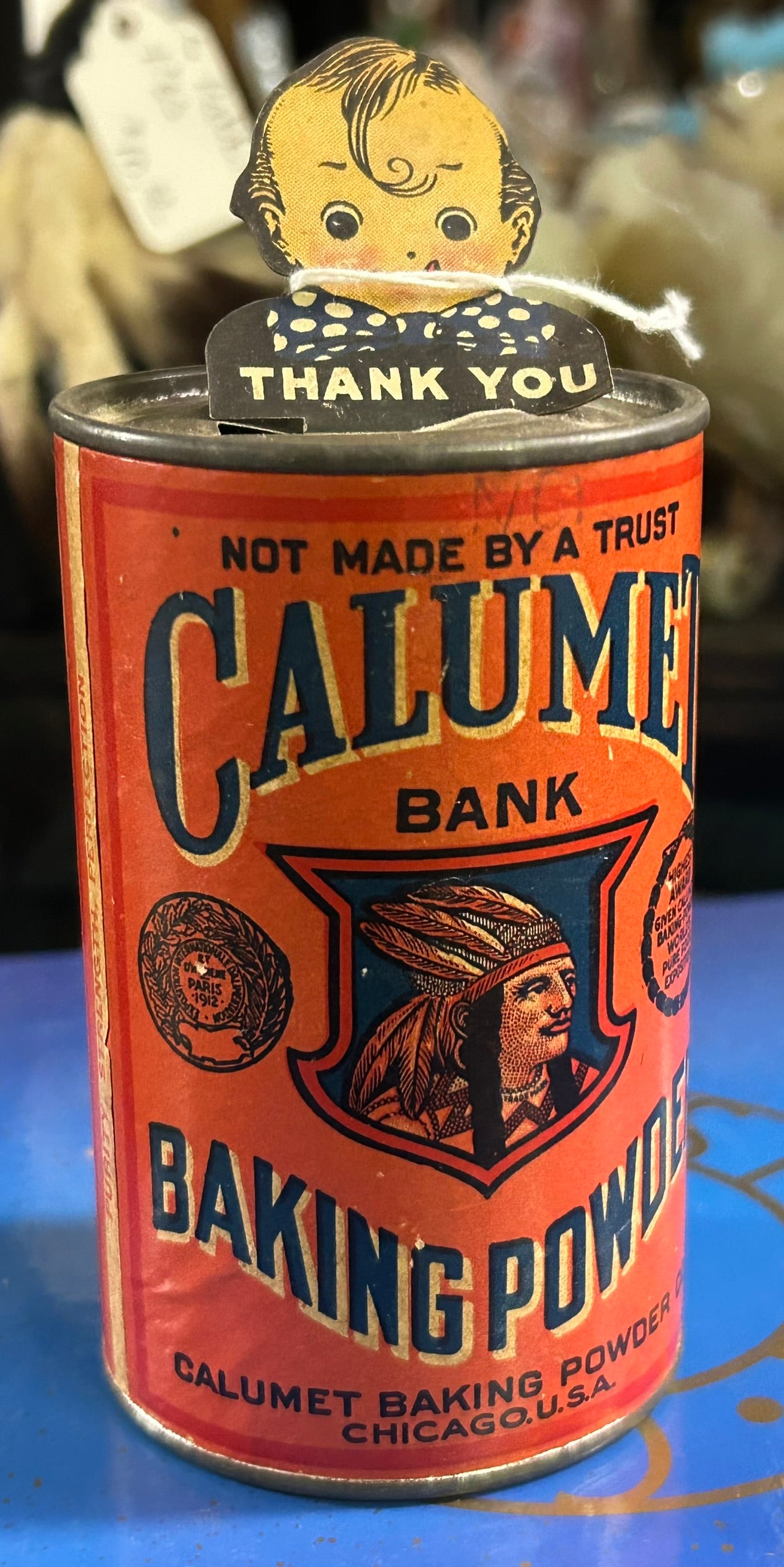 TIN CALUMET BAKING POWDER ANTIQUE KEWPIE SEMI MECHANICAL BANK