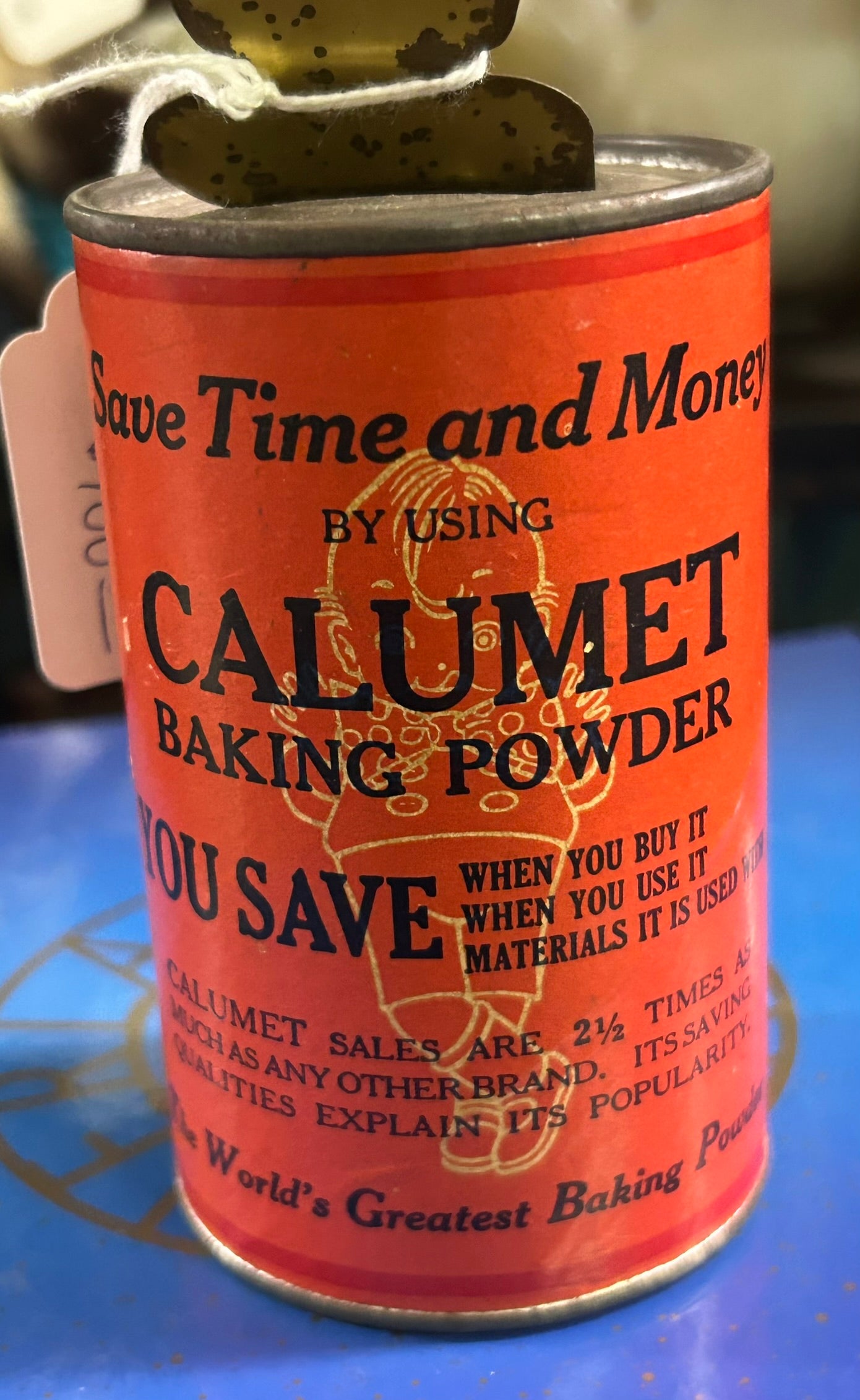 TIN CALUMET BAKING POWDER ANTIQUE KEWPIE SEMI MECHANICAL BANK