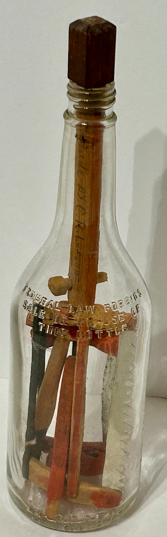 FOLK ART CARVED TOOLS IN BOTTLE