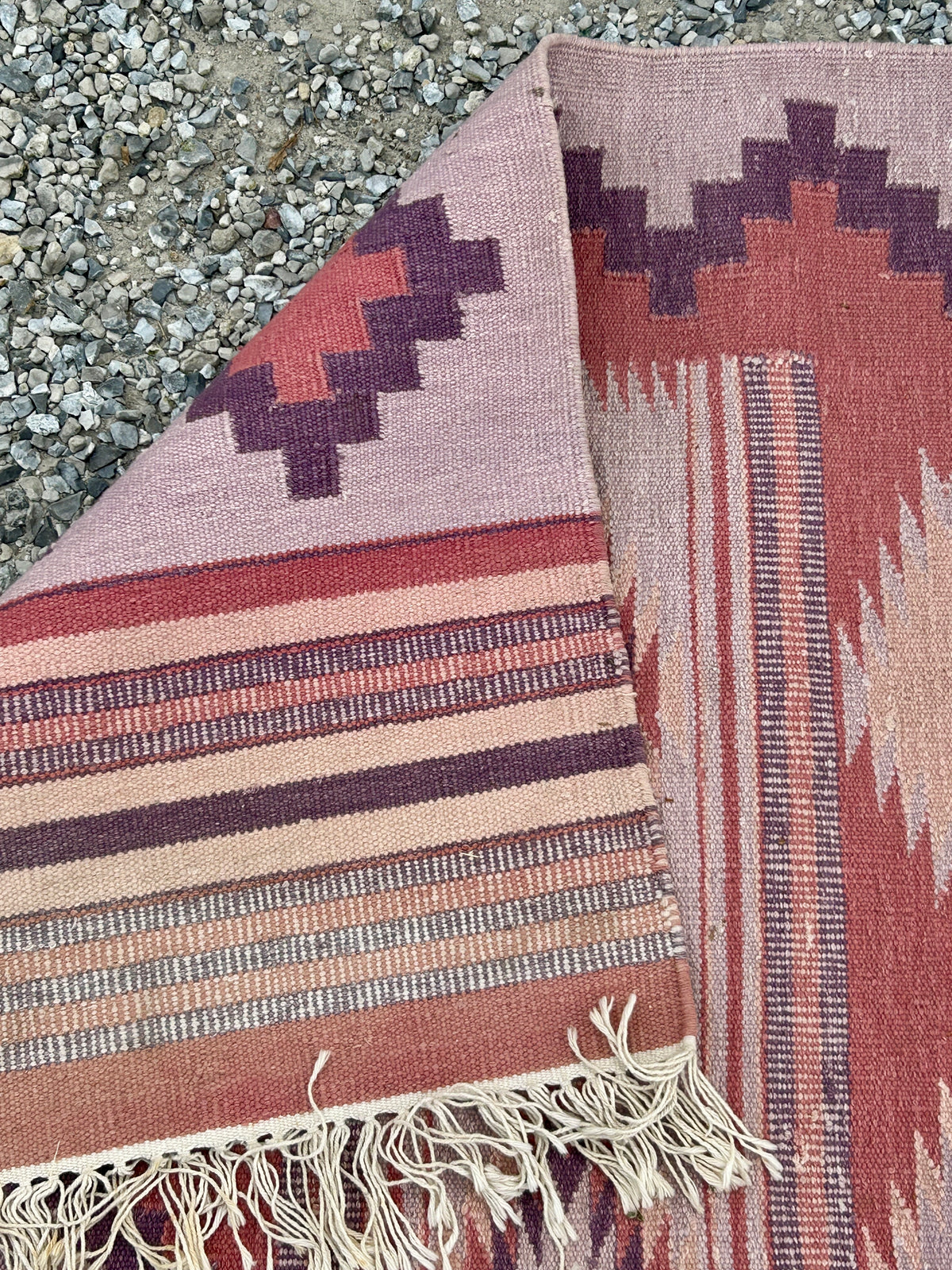 HANDMADE INDIA MAUVE AND PURPLE TRIBAL RUG MARKED WITH FABINDIA LABEL OR REVERSE