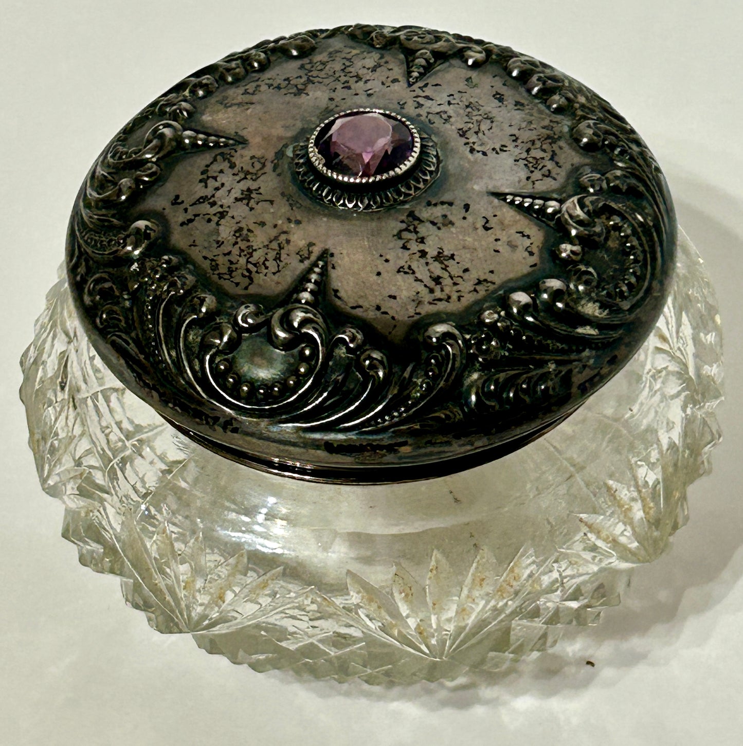 POWDER JAR ANTIQUE WITH STERLING AND AMETHYST COLOR STONE ON CUT GLASS JAR