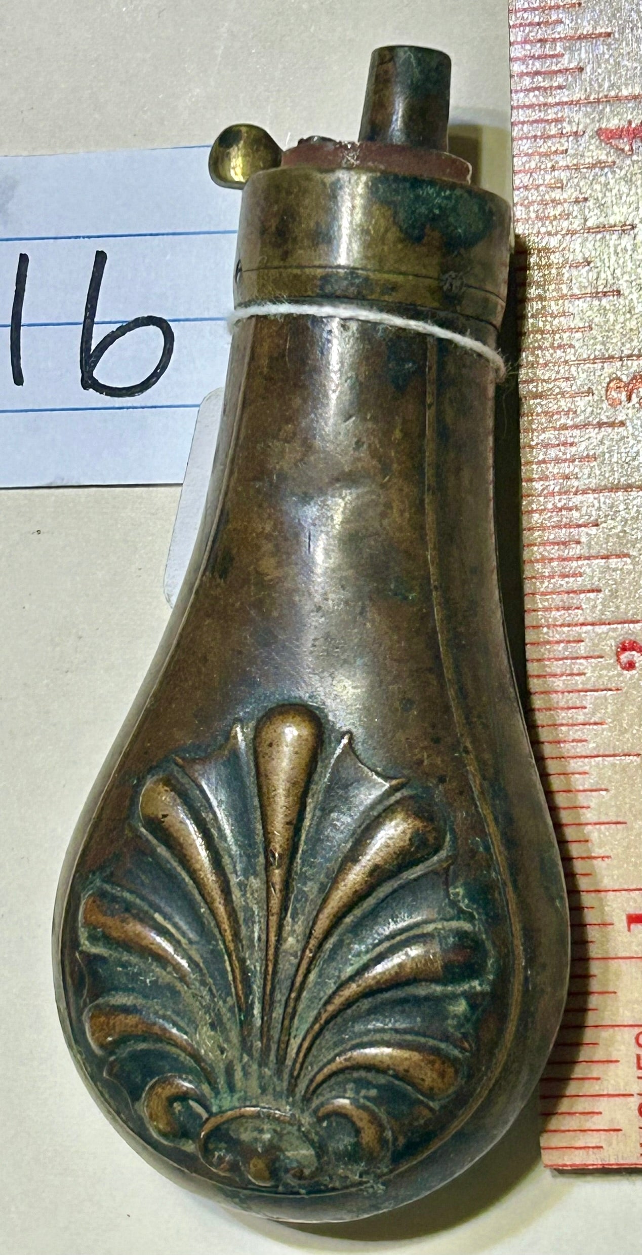 ANTIQUE POWER FLASK WITH SHELL DESIGN ON PISTOL SIZE