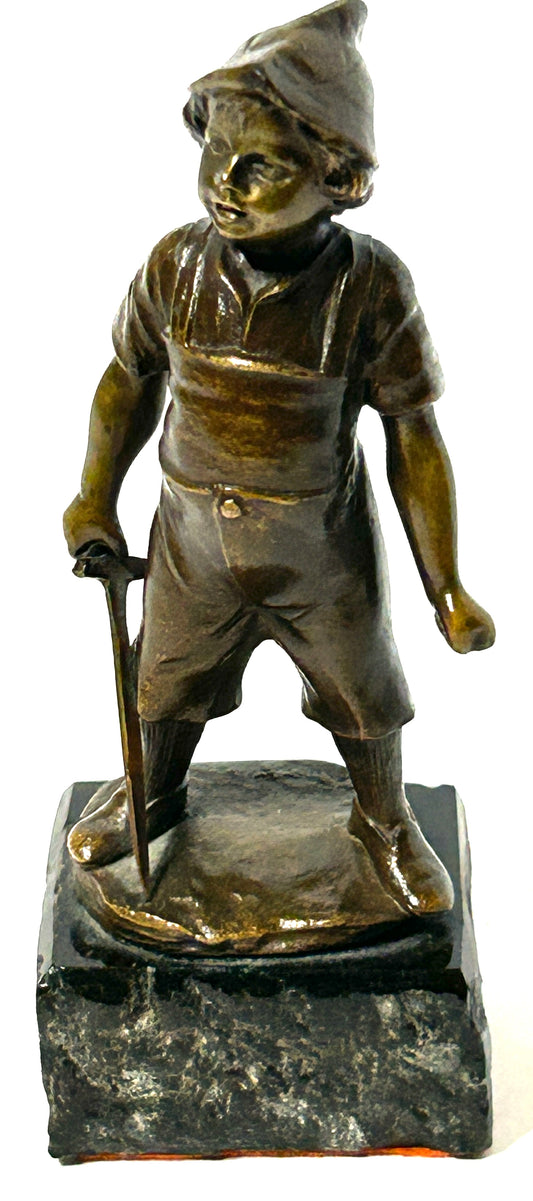 BRONZE SCULPTURE OF BOY WITH TOY SWORD