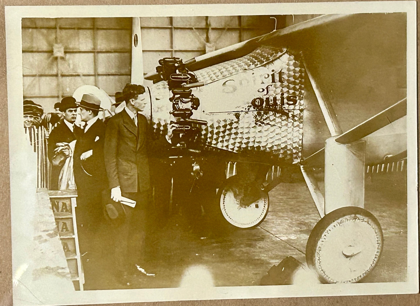 CHARLES LINDBERGH PHOTOGRAPH SHOWING HIM LOOKING AT SPIRIT OF ST. LOUIS