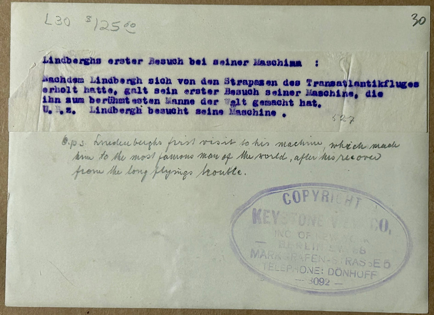 CHARLES LINDBERGH PHOTOGRAPH SHOWING HIM LOOKING AT SPIRIT OF ST. LOUIS