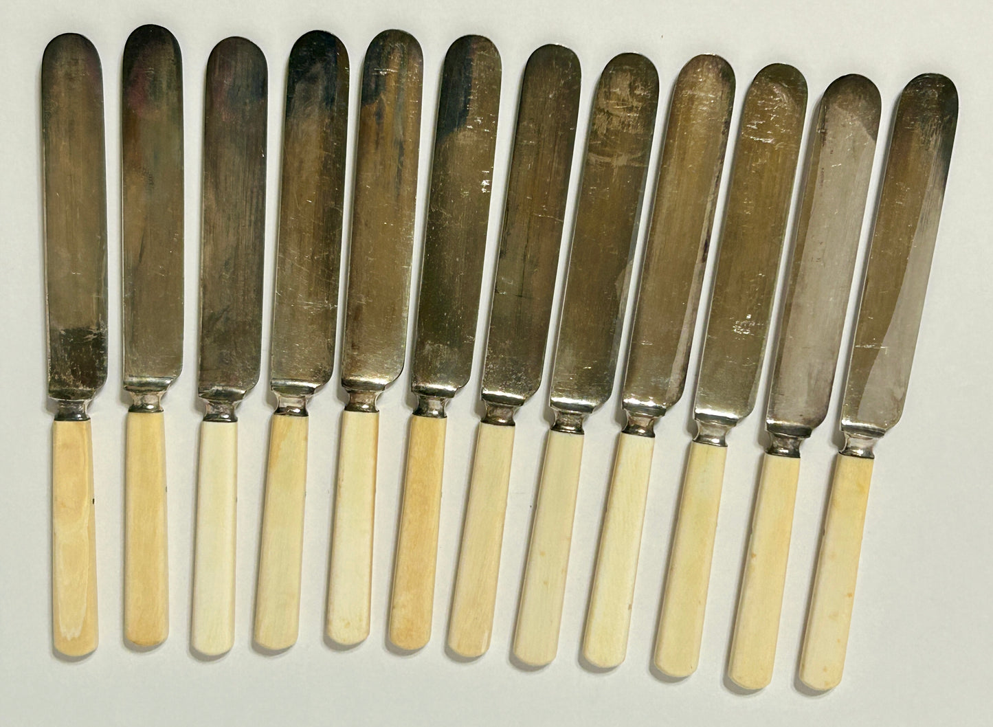 ANTIQUE IVORY HANDLE SET OF TWELVE KNIVES