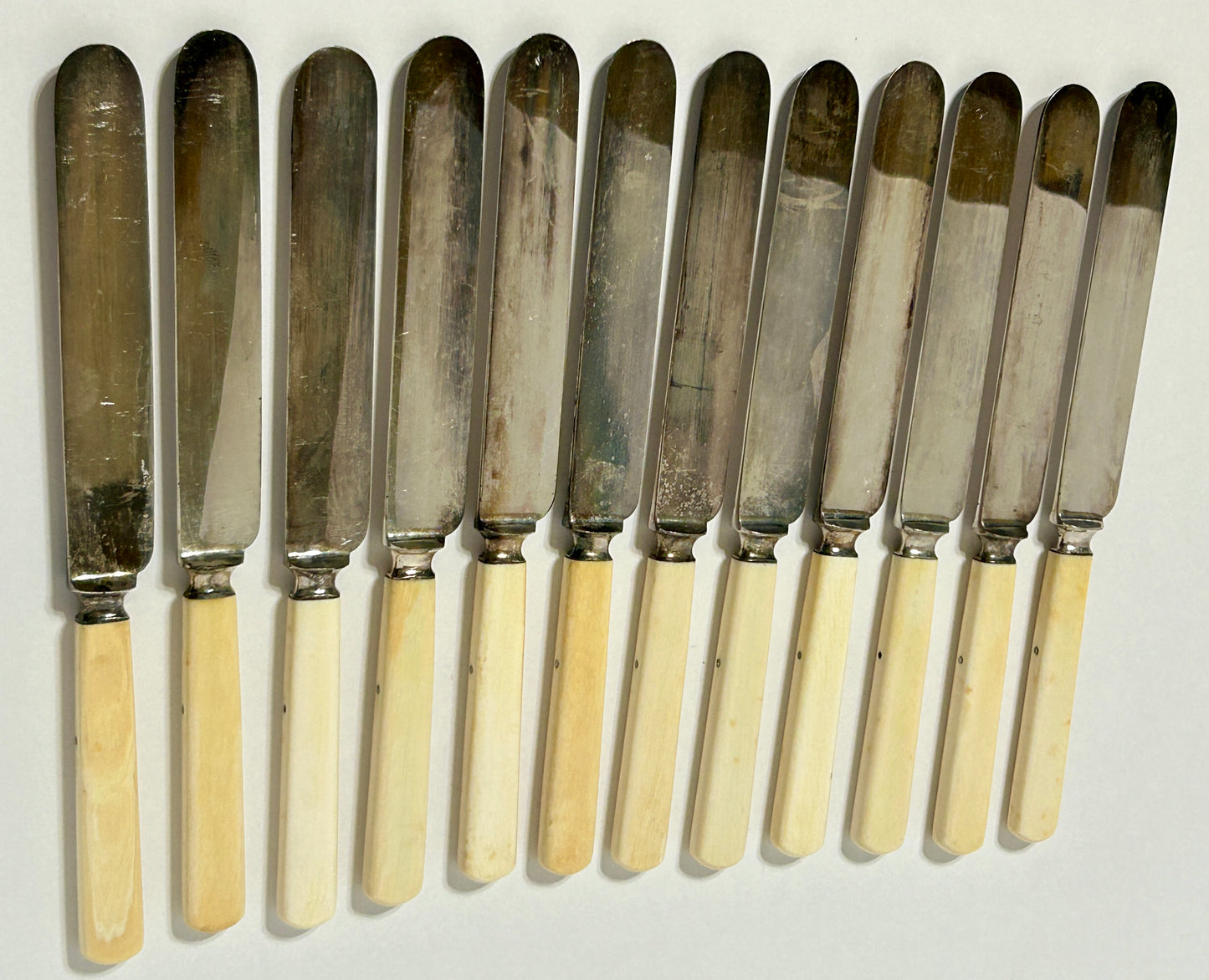 ANTIQUE IVORY HANDLE SET OF TWELVE KNIVES