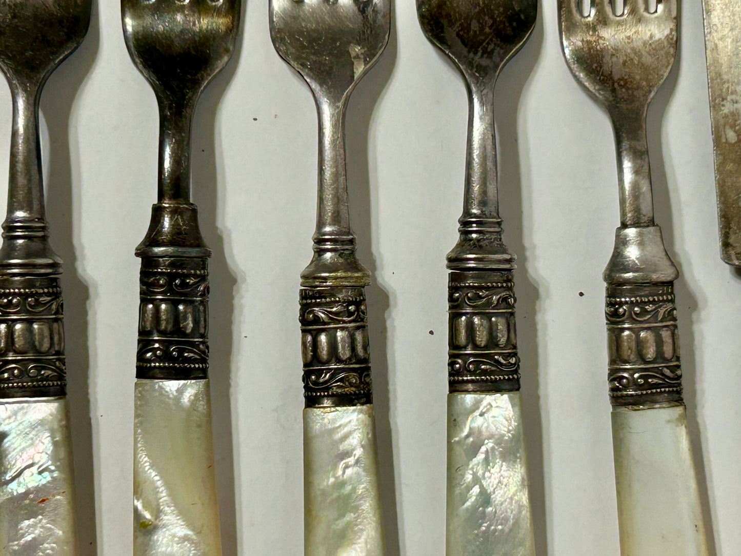 ANTIQUE STERLING AND MOTHER OF PEARL KNIVES AND FORKS
