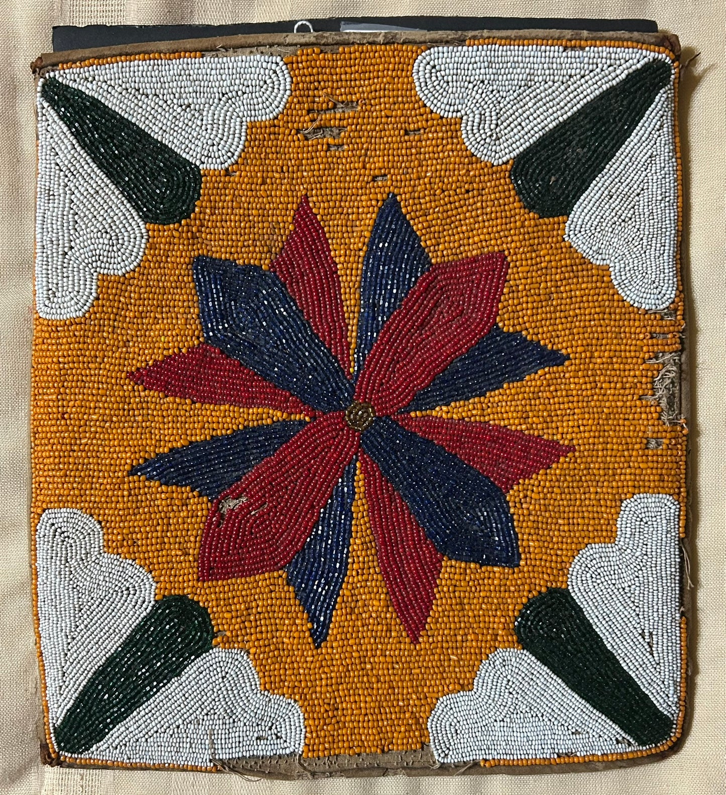 NATIVE AMERICAN BEADED FLAT BAG WITH SCULPTURED DESIGNS