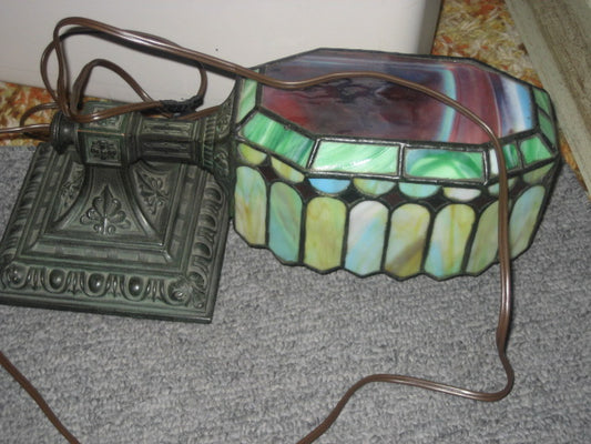 ANTIQUE DESK LAMP WITH ORNATE BASE AND LEADED SHADE