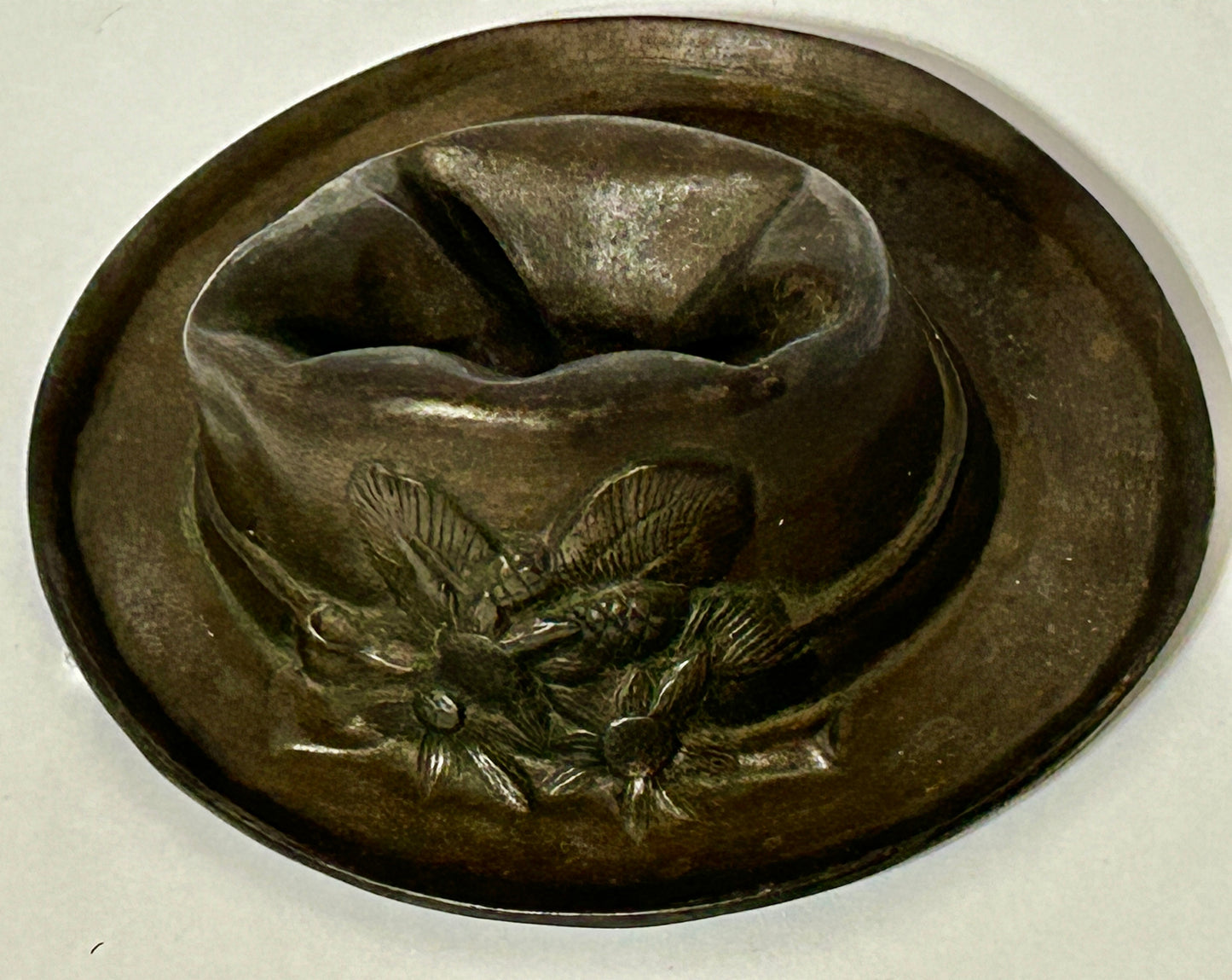 ANTIQUE CAST IRON HAT WITH SMASHED LOOK TOP