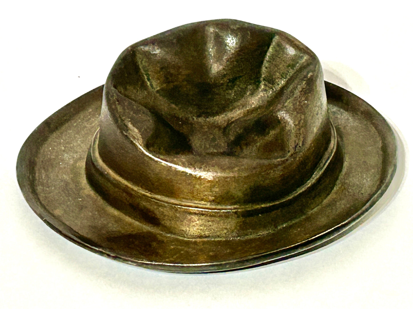 ANTIQUE CAST IRON HAT WITH SMASHED LOOK TOP