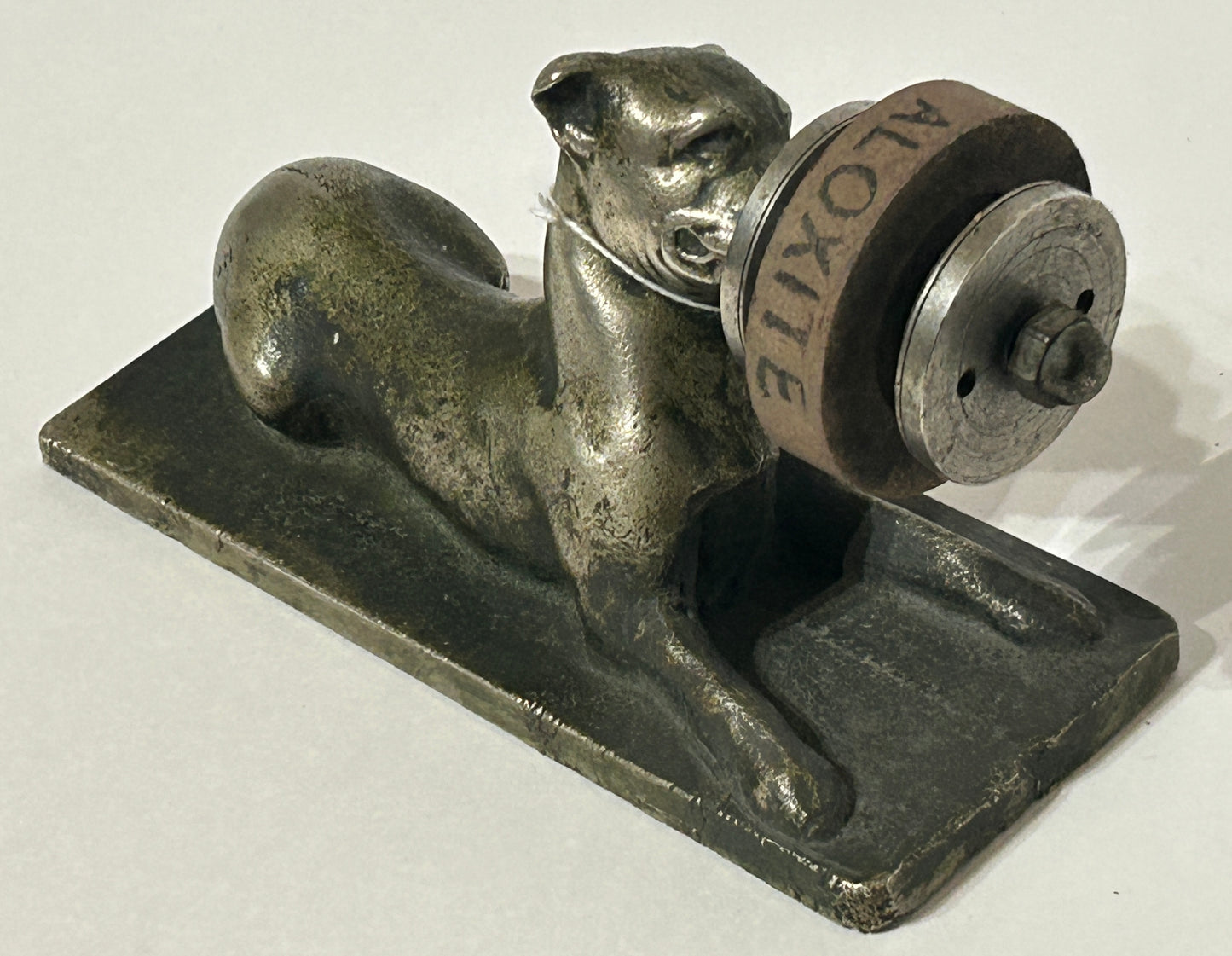 ANTIQUE CAST IRON FIGURAL DOG WITH SHARPENING DISC