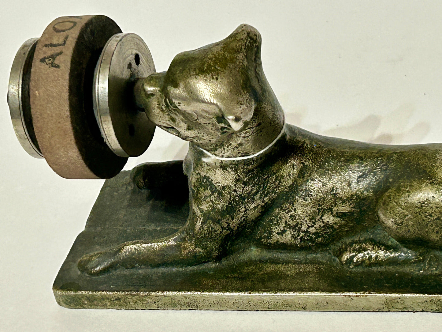 ANTIQUE CAST IRON FIGURAL DOG WITH SHARPENING DISC