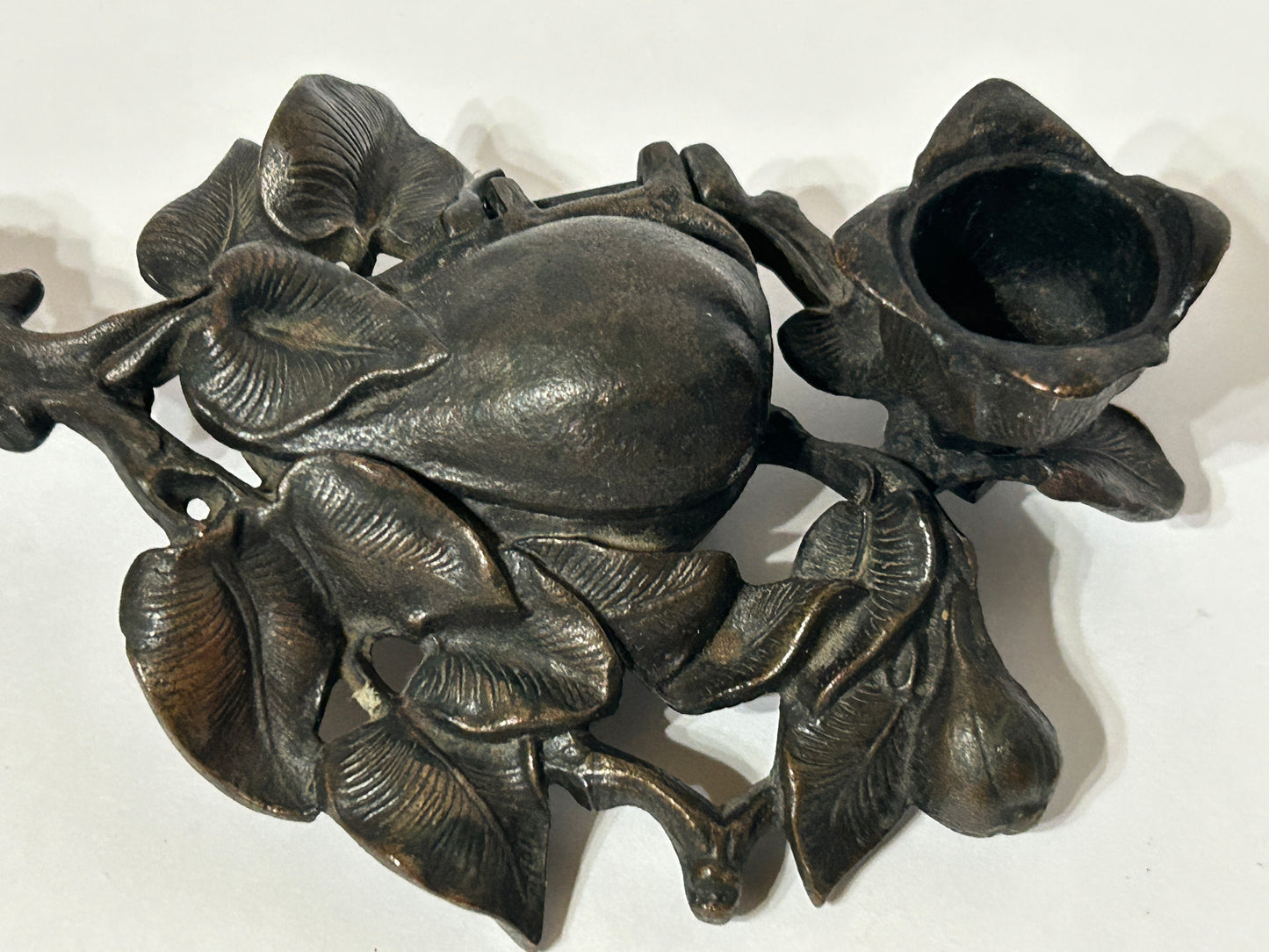 IRON ANTIQUE CANDLE AND MATCH HOLDER WITH FIGURAL PEAR AND LEAVES DESIGN