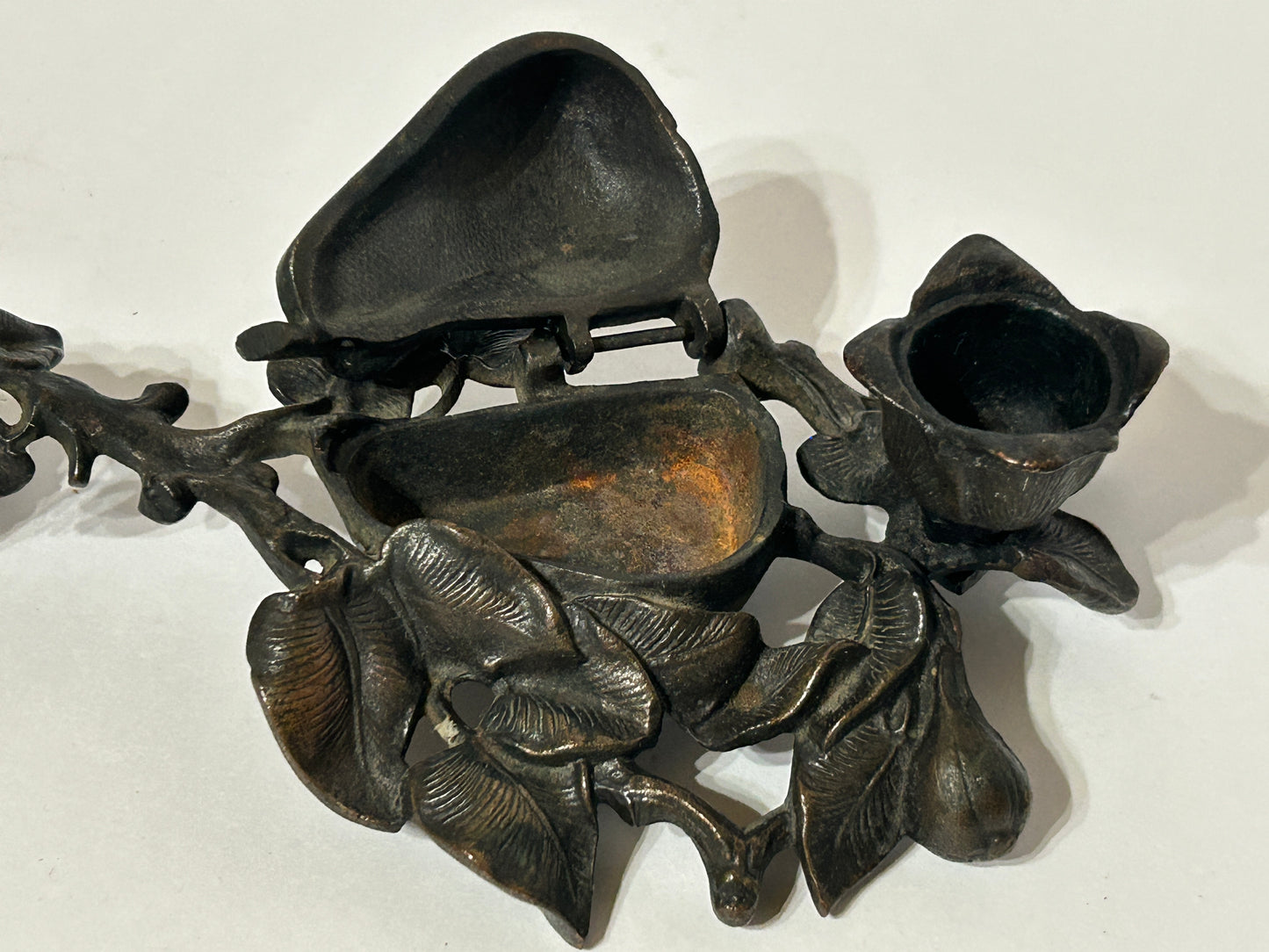 IRON ANTIQUE CANDLE AND MATCH HOLDER WITH FIGURAL PEAR AND LEAVES DESIGN