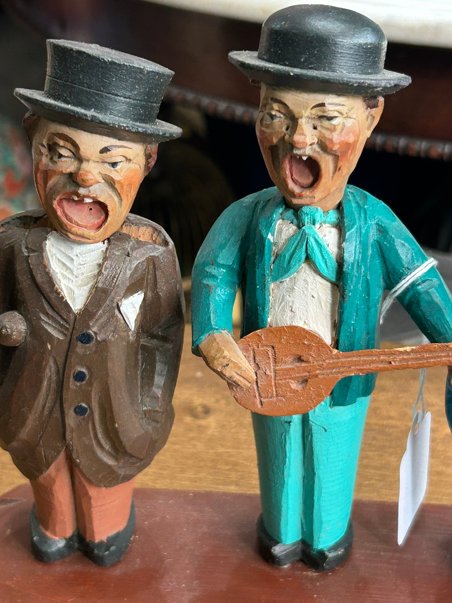 CARVED WOODEN FIGURES OF CORK SCREW, BOTTLE OPENER AND BOTTLE STOPPER