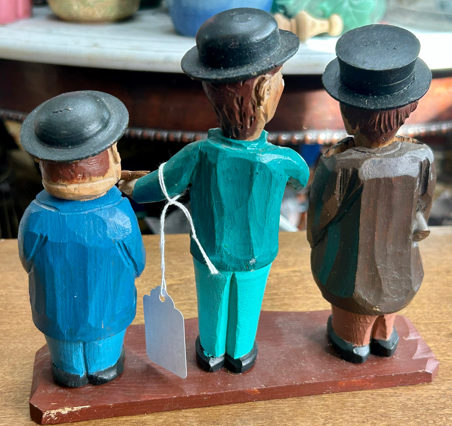 CARVED WOODEN FIGURES OF CORK SCREW, BOTTLE OPENER AND BOTTLE STOPPER