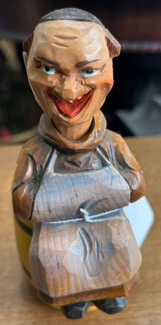 CARVED WOODEN FIGURAL CORKSCREW OF MONK SITTING ON BARREL WITH BOTTLE OPENER