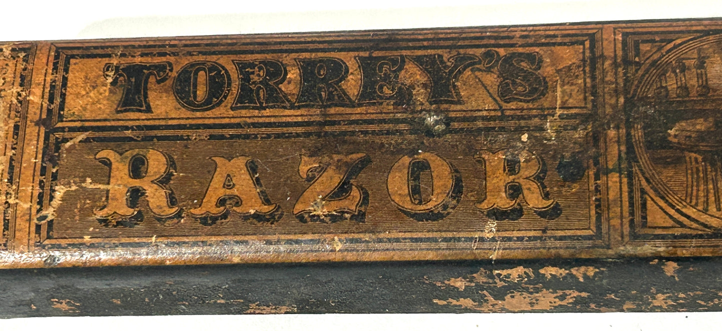 ANTIQUE RAZOR SHARPENER WITH GREAT LABEL
