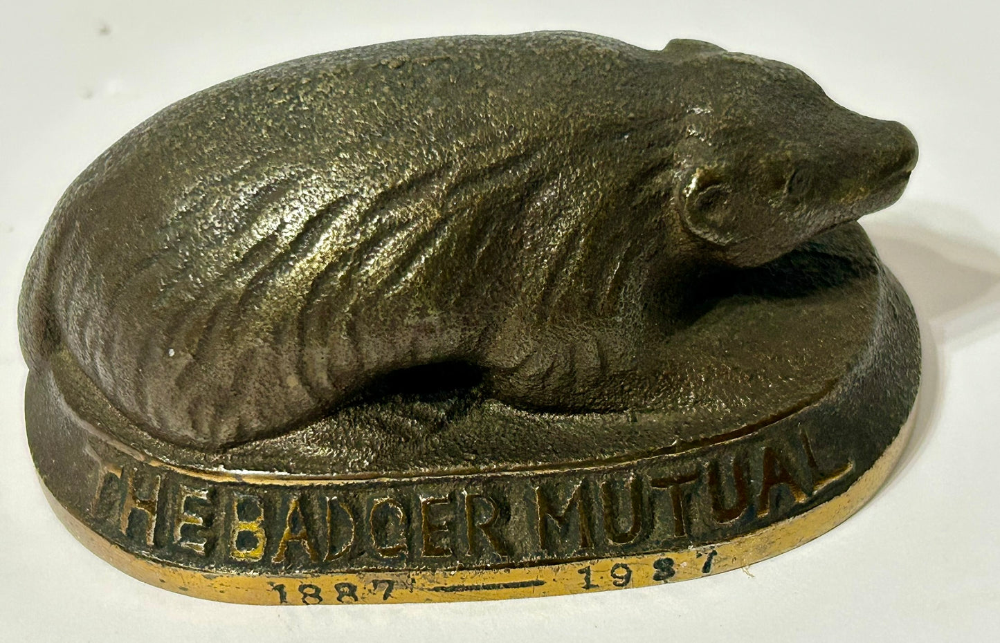 CAST IRON ANTIQUE ADVERTISING PAPERWEIGHT FOR BADGER MUTUAL INSURANCE