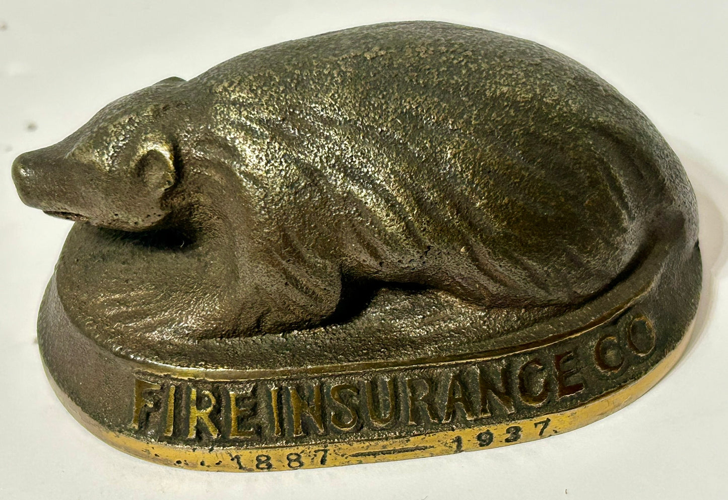 CAST IRON ANTIQUE ADVERTISING PAPERWEIGHT FOR BADGER MUTUAL INSURANCE